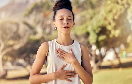 Fitness, woman and yoga breathing in relax for spiritual wellness, mental wellbeing or calm exercise in nature. Female relaxing, exercising and training in warm up breath activity for healthy workout.